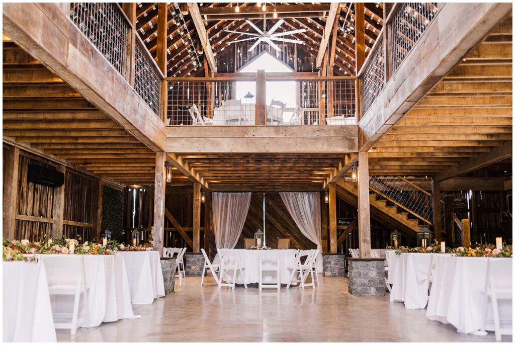Elegant barn interior at L&L Farm in Nashville, Tennessee, showcasing twinkling string lights and ample space for hosting wedding receptions.