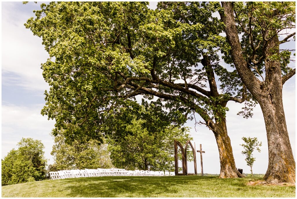 An outdoor sunset ceremony at The Ruby Cora wedding venue in Adams, Tennessee.
